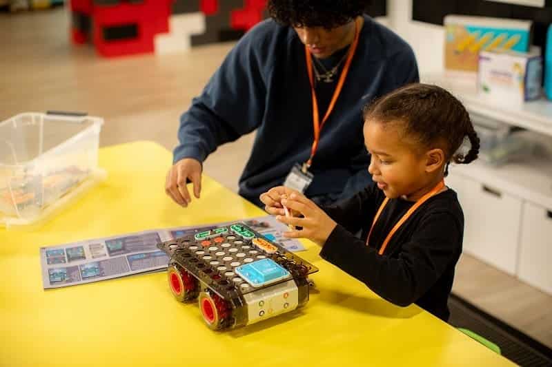Kids wiring simple circuits at a Frisco Fall Break STEM camp