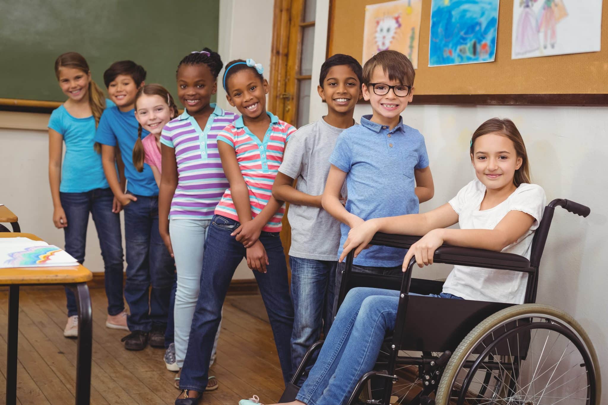 Leadership 8 disabled pupil smiling camera with classmates scaled